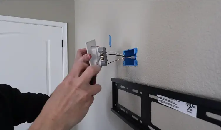 outlet behind TV mount